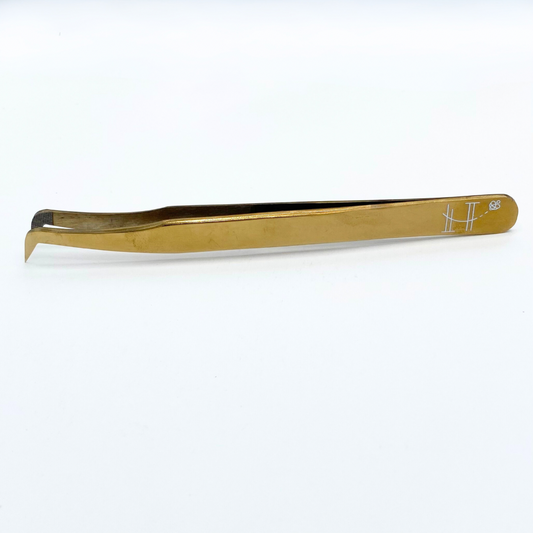 Gold booted tweezer- fiber tip